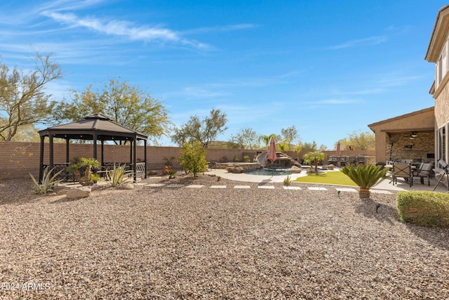 view of yard with a gazebo and a patio area