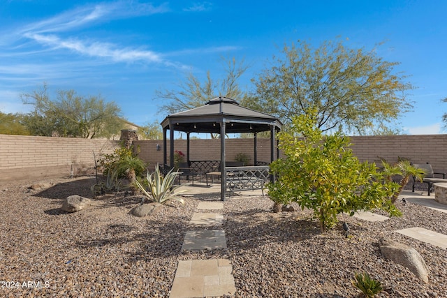 view of yard featuring a gazebo and a patio area