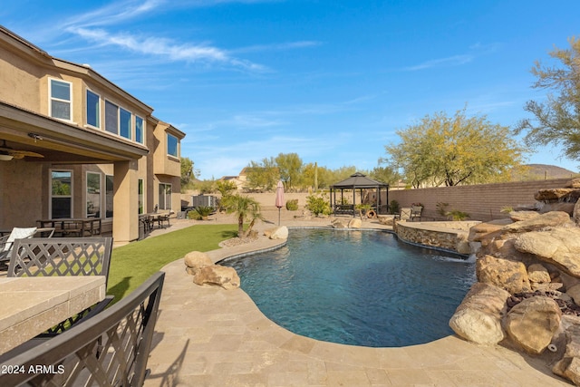 view of pool featuring a gazebo, a patio, and pool water feature