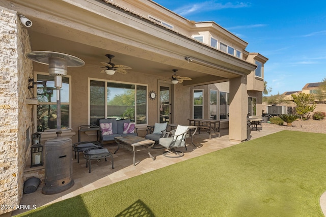 view of patio with ceiling fan and an outdoor living space