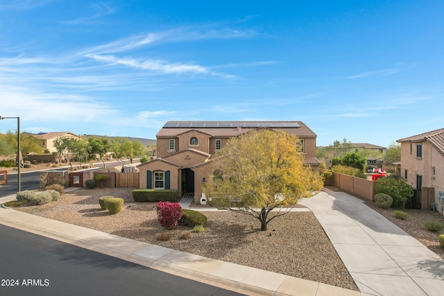 view of front of home with solar panels