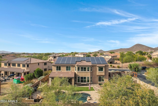 birds eye view of property with a mountain view