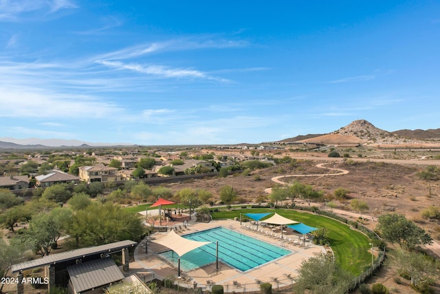 birds eye view of property featuring a mountain view