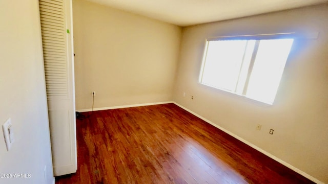3404 W Tangerine Ln, Phoenix, AZ 85051 - unfurnished bedroom with baseboards and wood finished floors