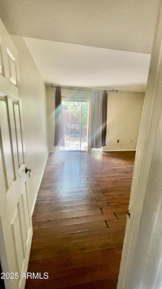 3404 W Tangerine Ln, Phoenix, AZ 85051 - corridor featuring hardwood / wood-style flooring and baseboards