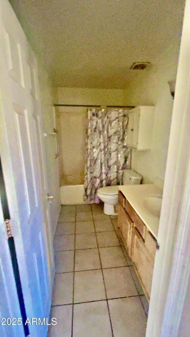 3404 W Tangerine Ln, Phoenix, AZ 85051 - bathroom with vanity, tile patterned floors, and toilet