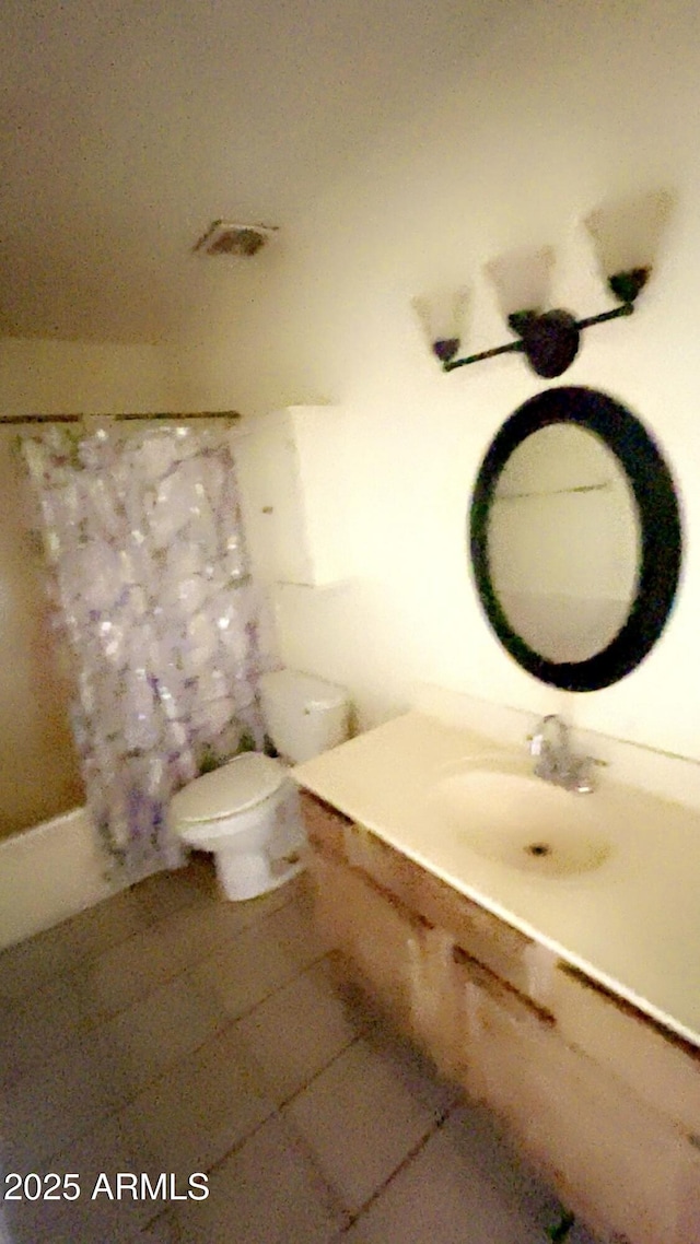 3404 W Tangerine Ln, Phoenix, AZ 85051 - full bathroom with toilet, vanity, and curtained shower