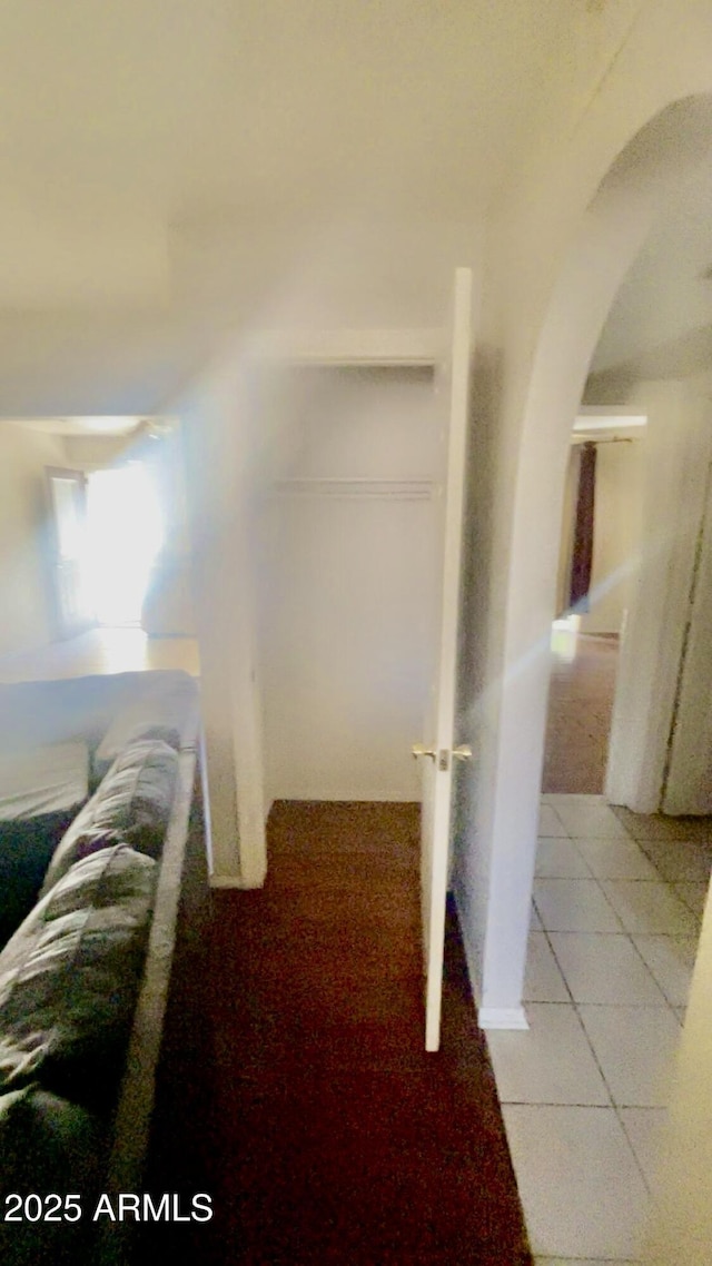 3404 W Tangerine Ln, Phoenix, AZ 85051 - hallway with arched walkways and light tile patterned floors