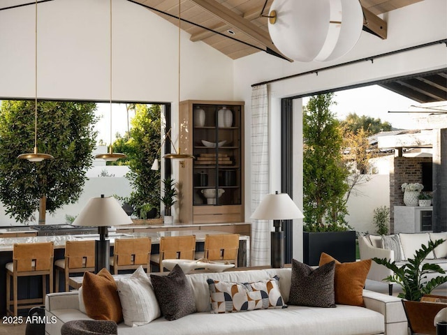 interior space with vaulted ceiling with beams