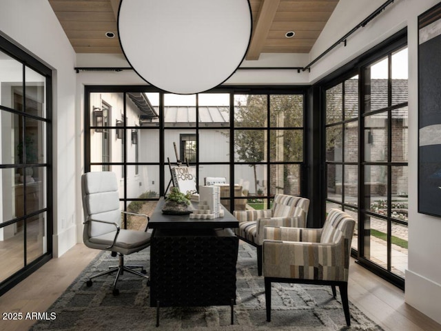 sunroom with wood ceiling and vaulted ceiling