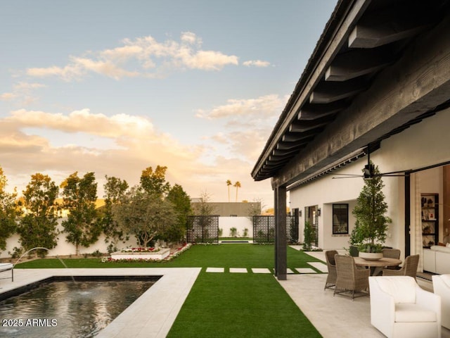 view of yard with a fenced in pool, a fenced backyard, and a patio