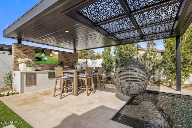 view of patio featuring an outdoor kitchen and outdoor dining area