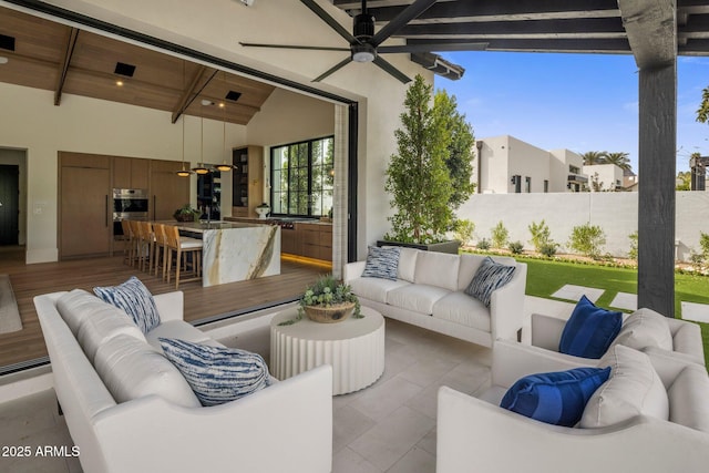 view of patio with a ceiling fan, visible vents, outdoor dry bar, and an outdoor hangout area