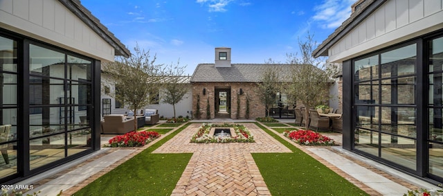 view of yard featuring a patio and outdoor lounge area