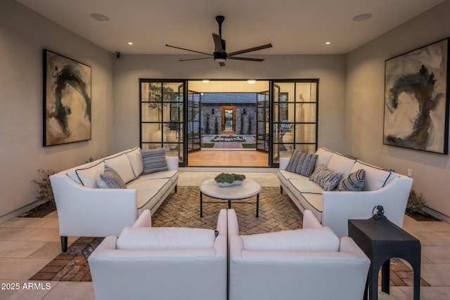 living room with ceiling fan and recessed lighting