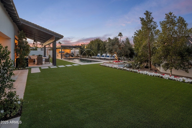 view of yard featuring fence, a fenced in pool, and a pergola