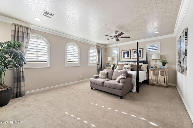 carpeted bedroom featuring a textured ceiling, ceiling fan, and ornamental molding