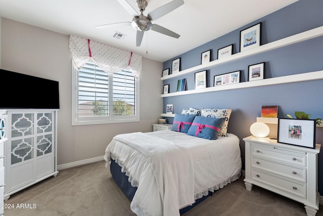 bedroom with ceiling fan and carpet floors