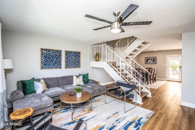 living room with hardwood / wood-style floors and ceiling fan