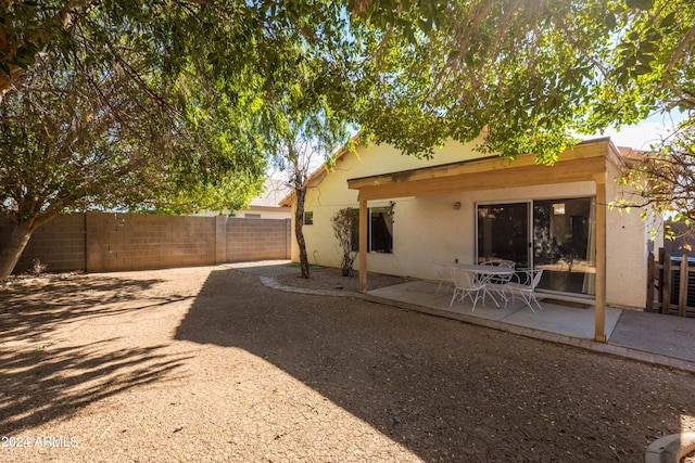 rear view of property featuring a patio