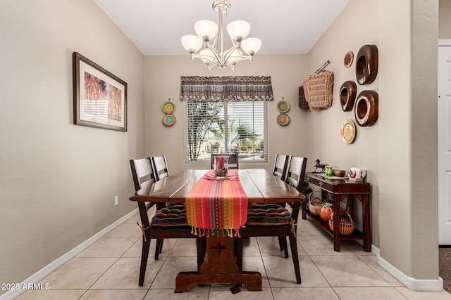 dining space featuring an inviting chandelier and light tile patterned floors