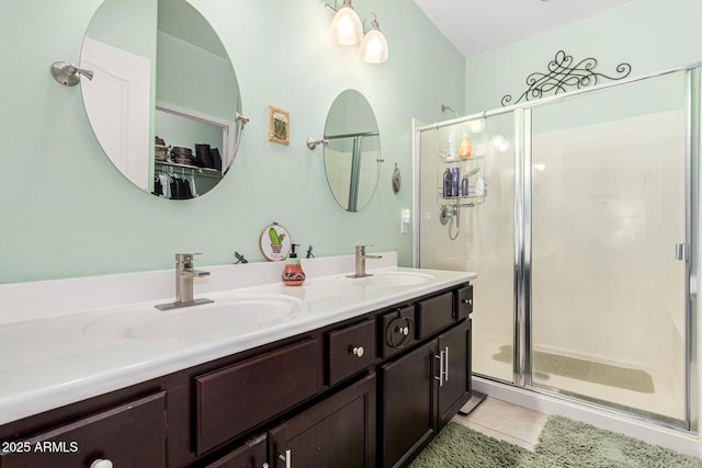 bathroom with vanity, tile patterned flooring, and a shower with shower door