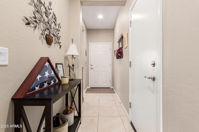 hallway featuring light tile patterned flooring