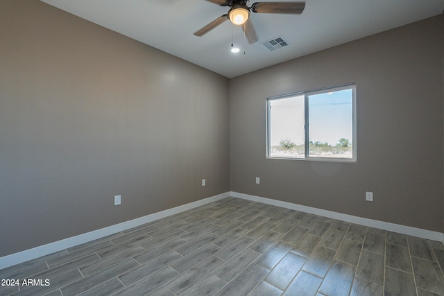 spare room featuring ceiling fan and light hardwood / wood-style floors