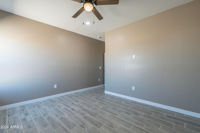 unfurnished room with ceiling fan and hardwood / wood-style flooring