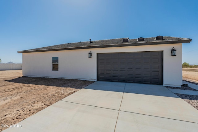 view of side of property with a garage