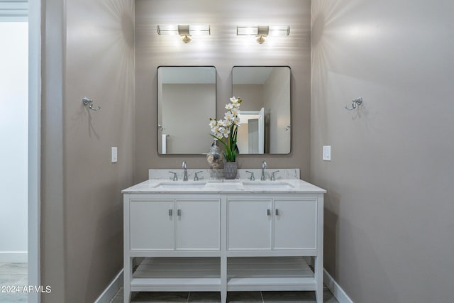 bathroom with tile patterned floors and vanity