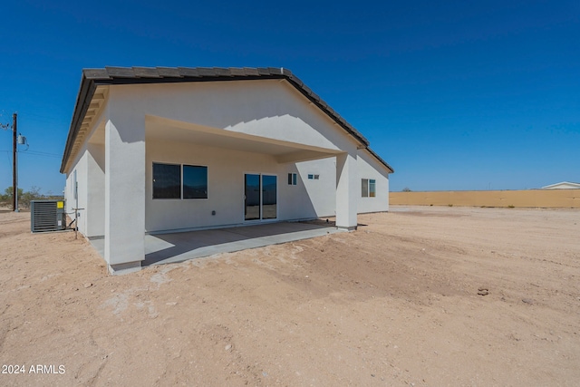 back of house featuring a patio and cooling unit