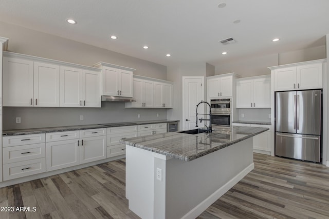 3785 W Silverdale Rd, Queen Creek, AZ 85144 - kitchen with white cabinets, wood-type flooring, sink, and stainless steel appliances