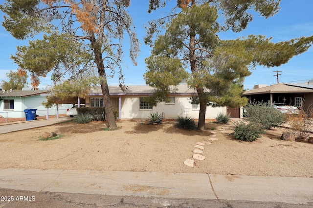 single story home featuring an attached carport