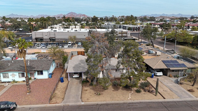 drone / aerial view featuring a residential view and a mountain view