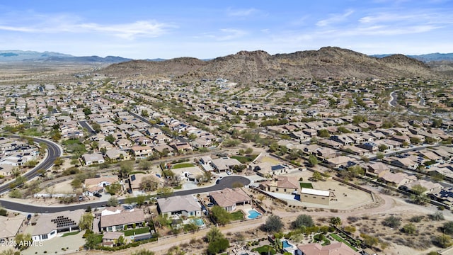 drone / aerial view featuring a residential view and a mountain view