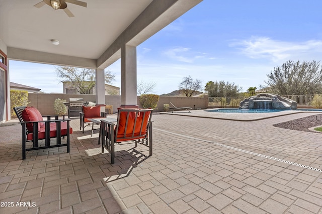 view of patio / terrace with a fenced in pool, a fenced backyard, and an outdoor hangout area