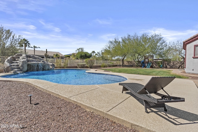 view of pool featuring a patio, a playground, a fenced backyard, and a fenced in pool