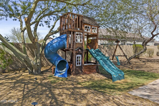 view of playground featuring fence