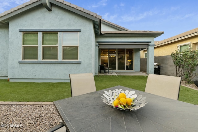 back of property featuring a patio