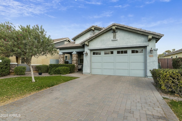 view of front facade featuring a garage and a front lawn