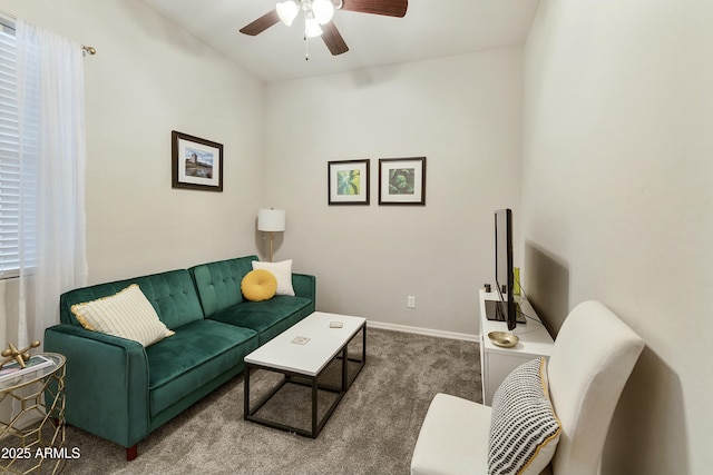 carpeted living room with ceiling fan