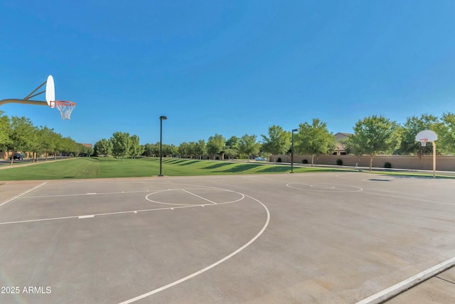 view of basketball court featuring a lawn