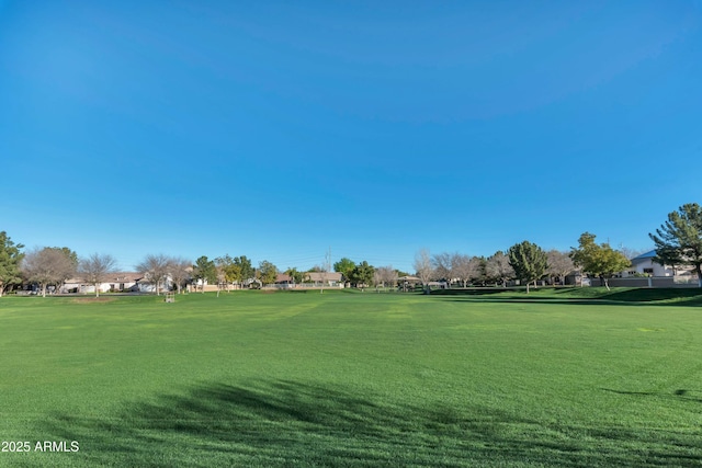 view of property's community featuring a lawn