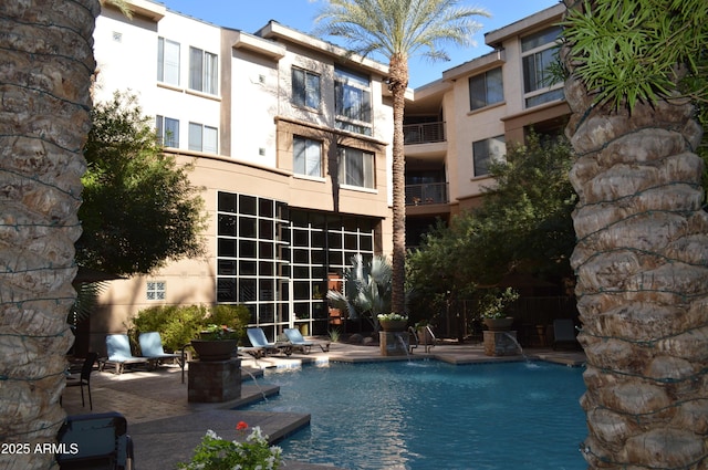 community pool with a patio