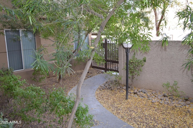 view of gate with fence