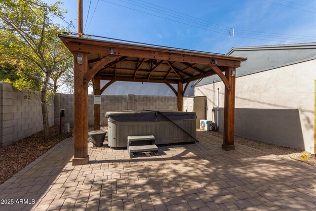 view of patio with a gazebo and a hot tub