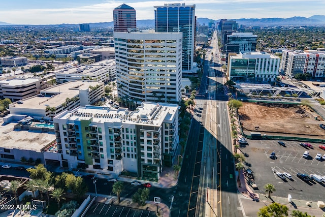 birds eye view of property featuring a mountain view