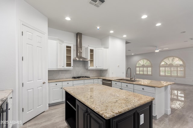 4711 E Buckboard Ct, Gilbert, AZ 85297 - kitchen with a sink, wall chimney range hood, a peninsula, a kitchen island, and white cabinets