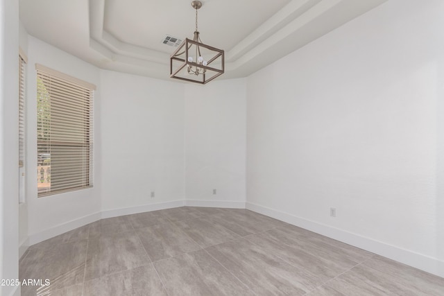 4711 E Buckboard Ct, Gilbert, AZ 85297 - empty room with a chandelier, a raised ceiling, and baseboards